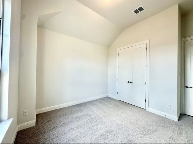 a bathroom with a double vanity sink toilet and shower