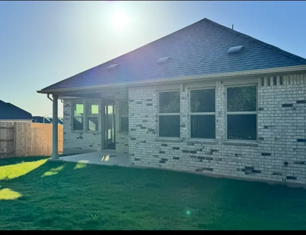 a bathroom with a sink mirror and toilet