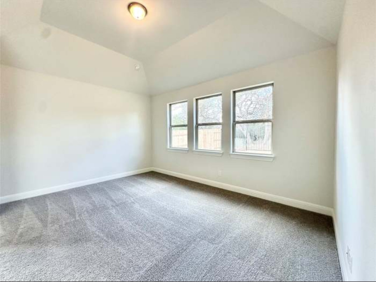 528 Tubman Drive Kyle, TX 78640 - Photo 9 of 27 an empty room with windows