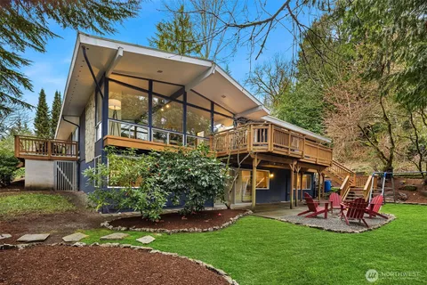 a view of a house with a yard porch and sitting area