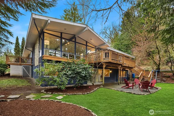 a view of a house with a yard porch and sitting area