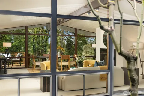 a view of living room with furniture and windows