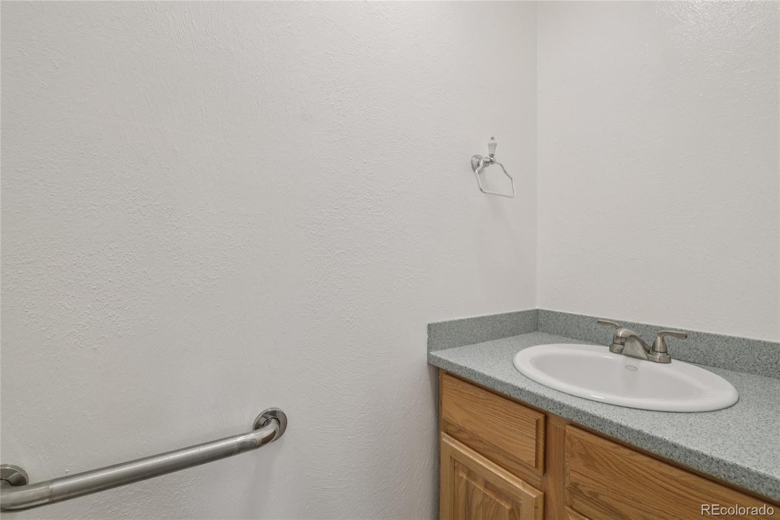 1169 Monroe Drive, Unit B Boulder, CO 80303 - Photo 15 of 32 a bathroom with a sink and vanity