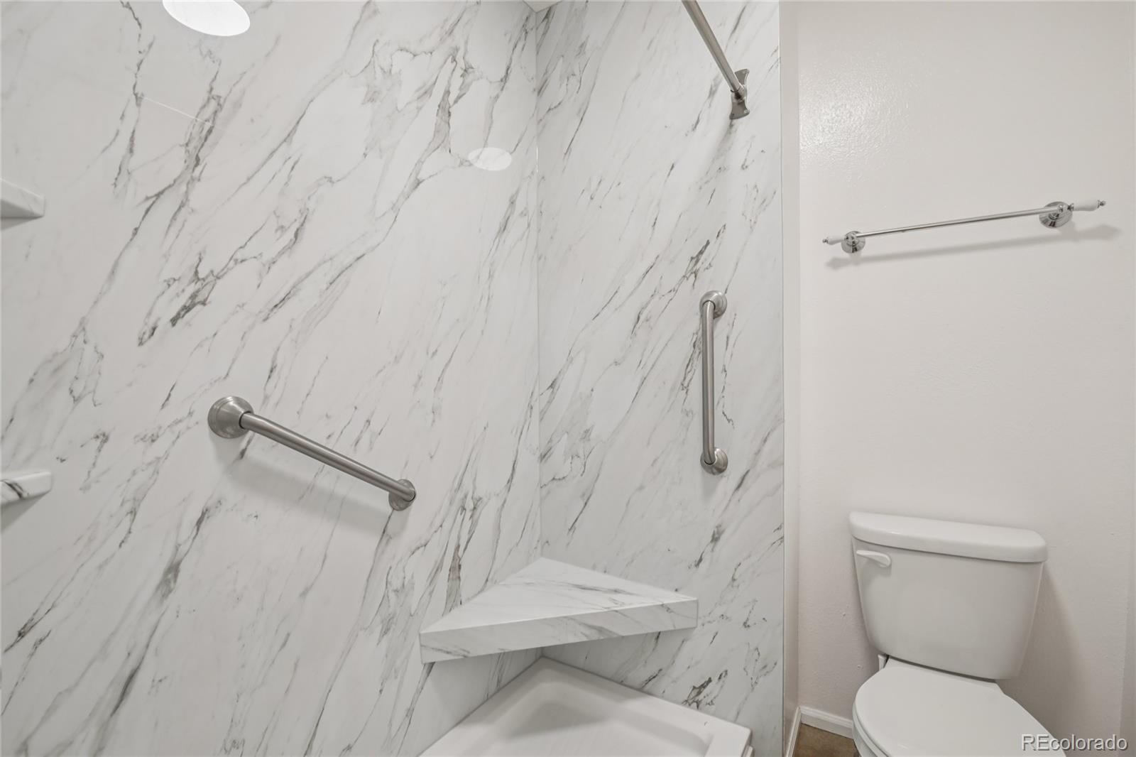 1169 Monroe Drive, Unit B Boulder, CO 80303 - Photo 17 of 32 a bathroom with a toilet and a shower