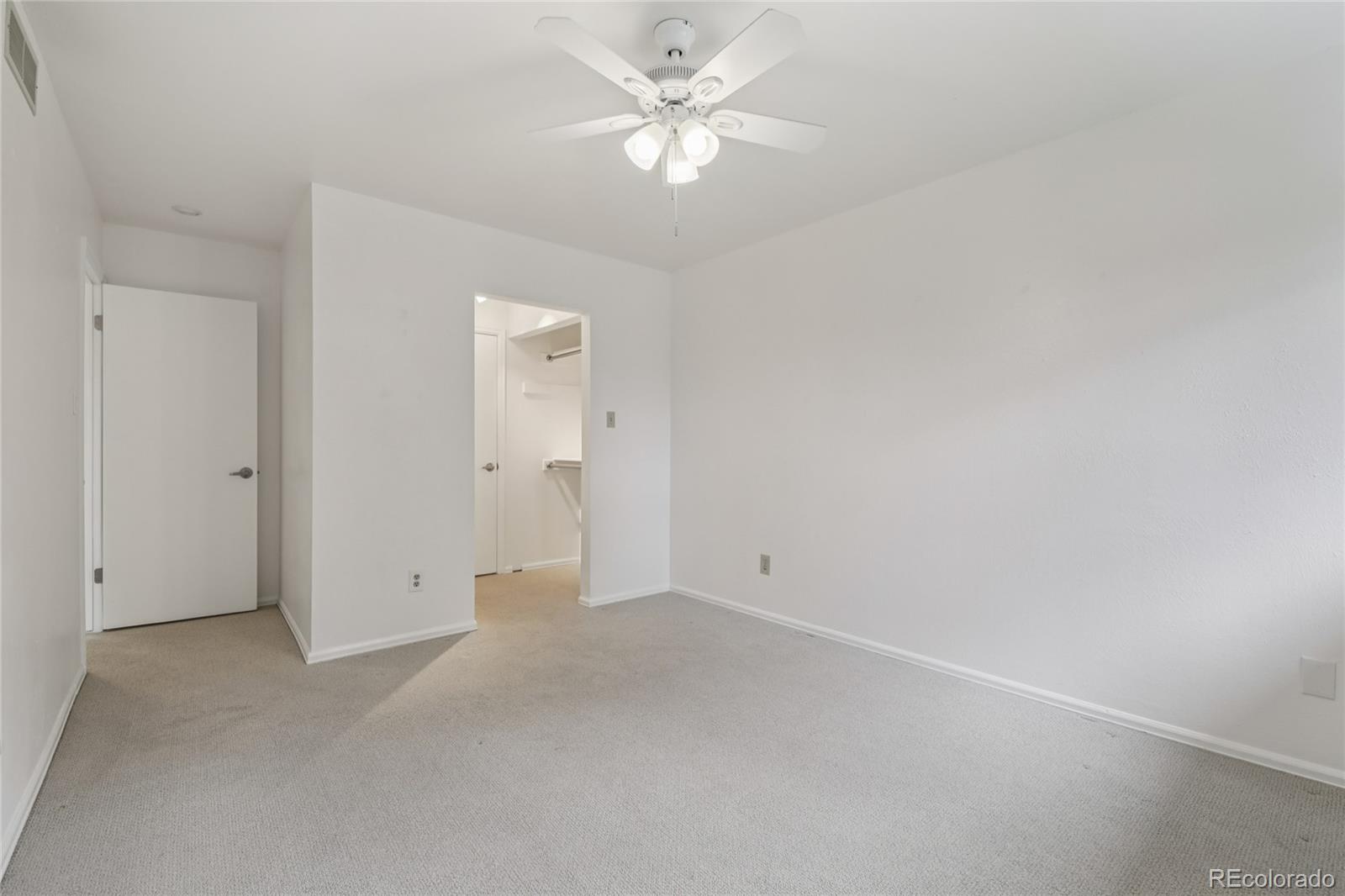 1169 Monroe Drive, Unit B Boulder, CO 80303 - Photo 21 of 32 an empty room with fan and a ceiling fan