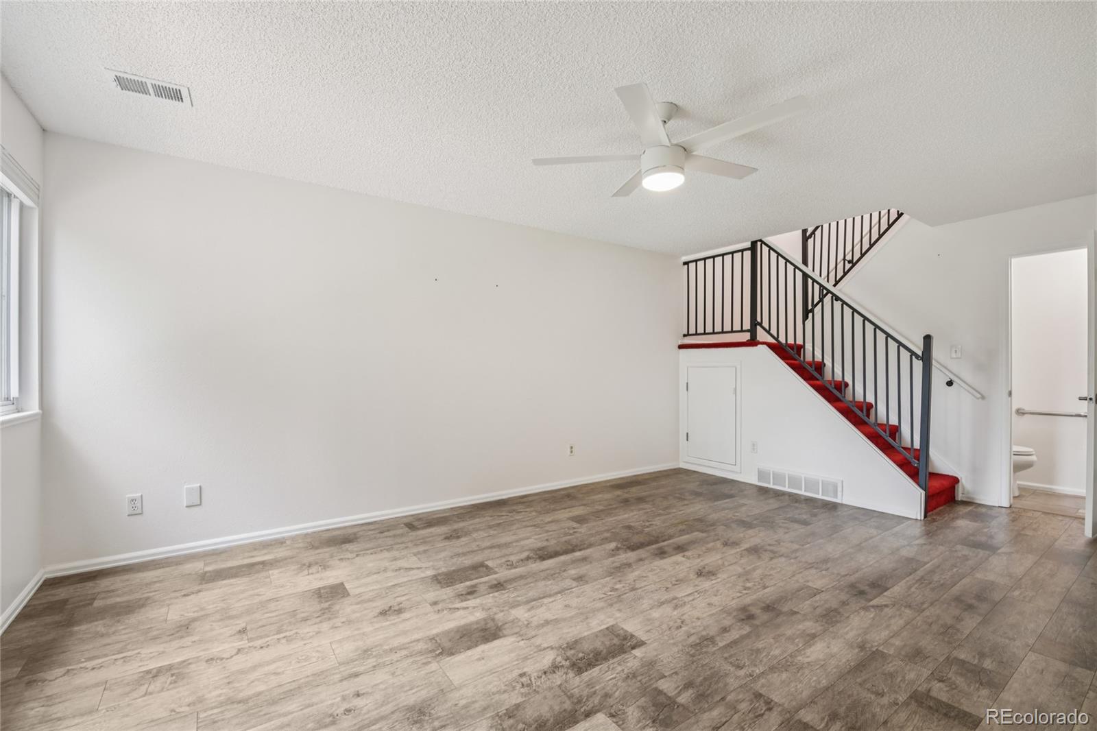 1169 Monroe Drive, Unit B Boulder, CO 80303 - Photo 4 of 32 a view of a hallway with a ceiling fan