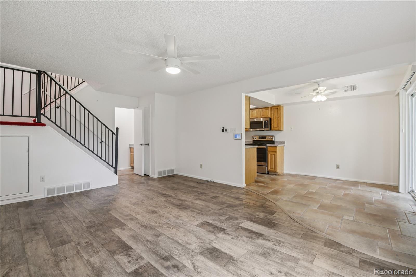 1169 Monroe Drive, Unit B Boulder, CO 80303 - Photo 5 of 32 a view of empty room with wooden floor