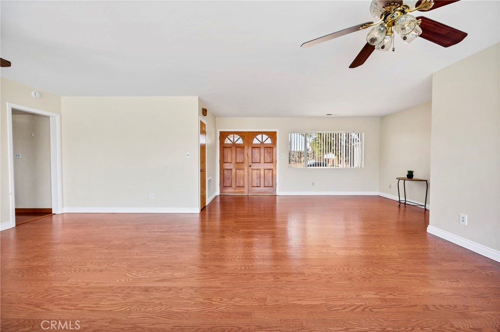 26320 Rim Road Hemet, CA 92544 - Photo 11 of 50 a view of an empty room with window and wooden floor