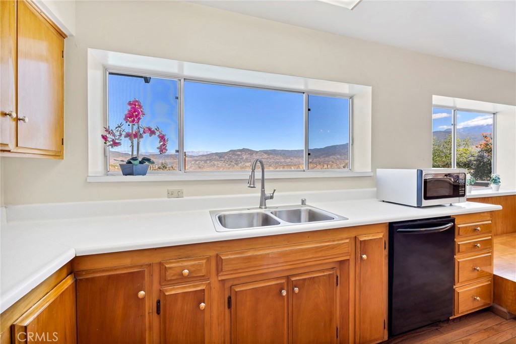 26320 Rim Road Hemet, CA 92544 - Photo 18 of 50 a kitchen with stainless steel appliances a sink and cabinets