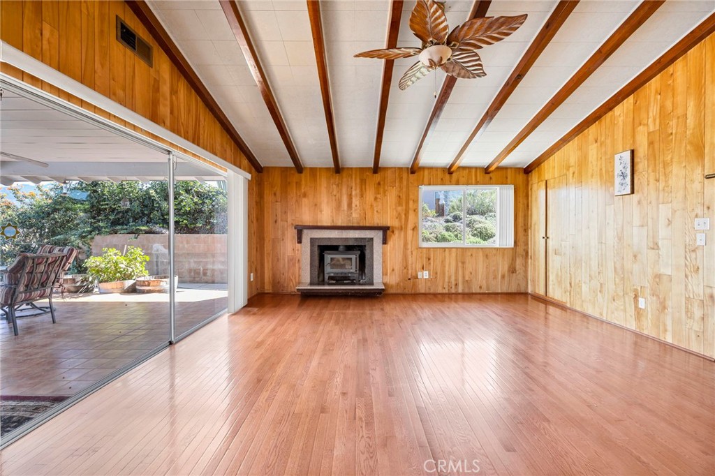 26320 Rim Road Hemet, CA 92544 - Photo 25 of 50 a view of empty room with wooden floor and fireplace