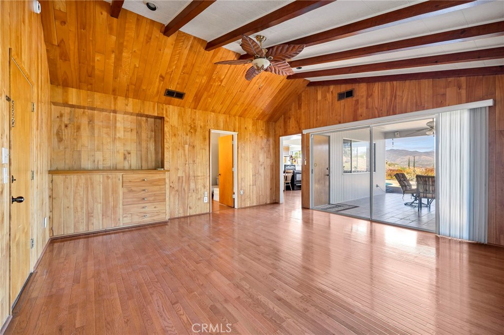 26320 Rim Road Hemet, CA 92544 - Photo 26 of 50 a view of an empty room with wooden floor and a window