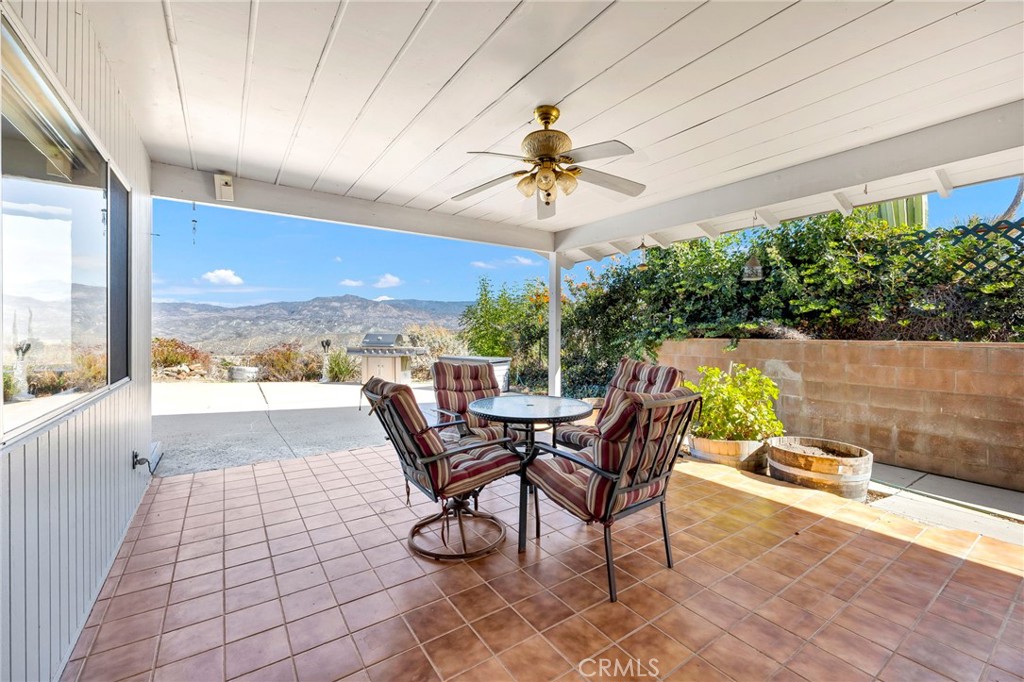 26320 Rim Road Hemet, CA 92544 - Photo 33 of 50 a view of a patio with a dining table and chairs
