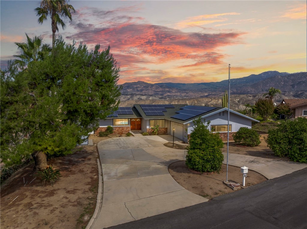 26320 Rim Road Hemet, CA 92544 - Photo 4 of 50 a view of a house with a yard and potted plants