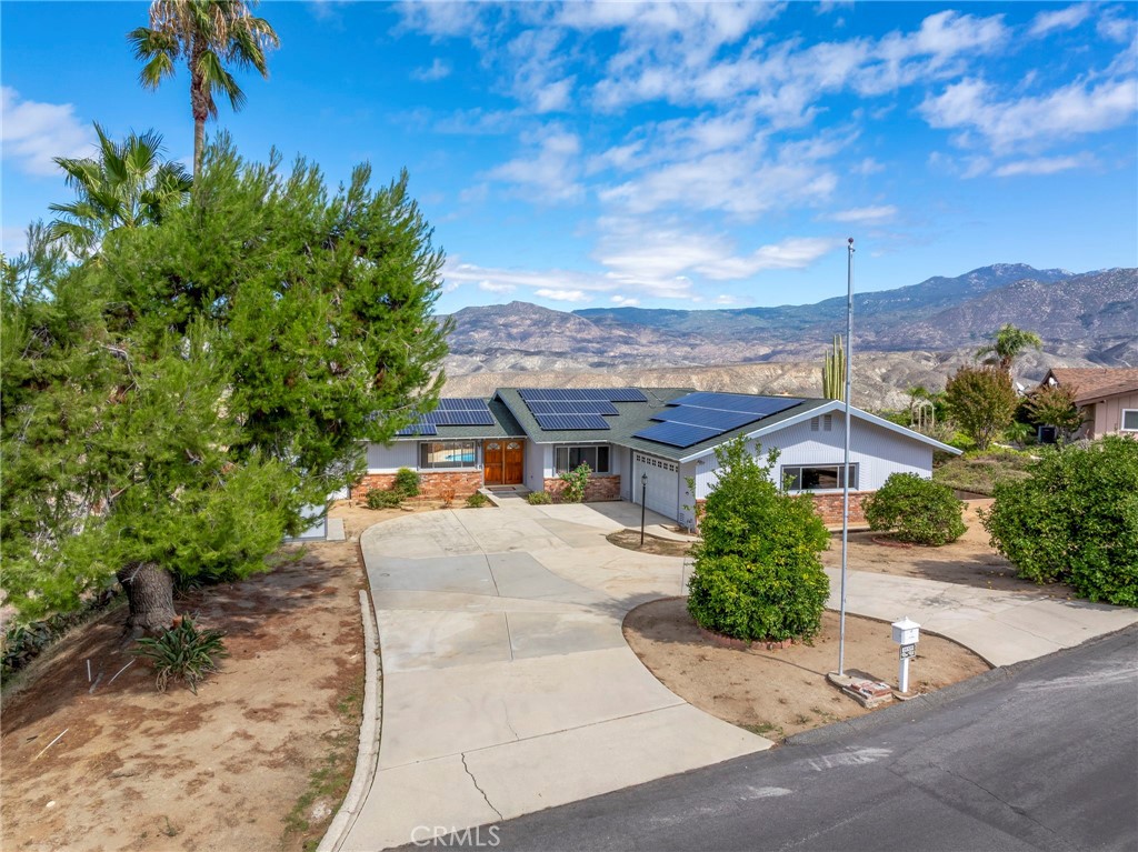 26320 Rim Road Hemet, CA 92544 - Photo 48 of 50 a view of a house with a yard and potted plants