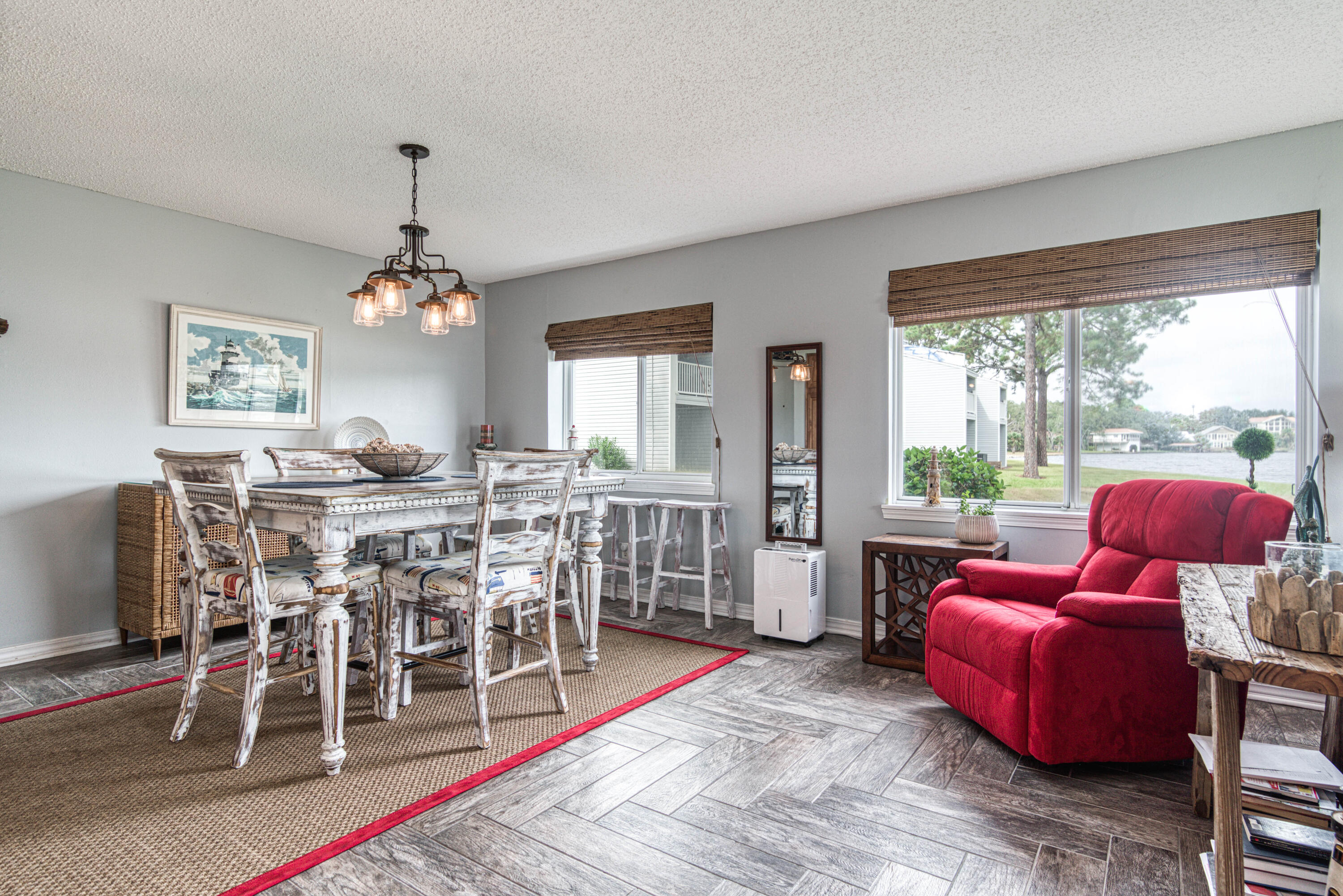 101 Old Ferry Road, Unit 26A Shalimar, FL 32579 - Photo 8 of 61 a dining room with furniture a chandelier and wooden floor