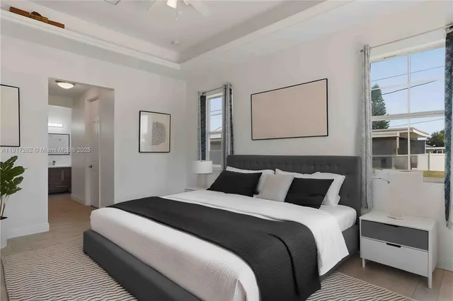 a bedroom with bed and a night stand