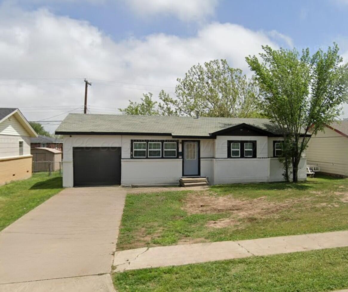 0 Southlawn Package Amarillo, TX 79110 - Photo 9 of 9 a front view of house with yard and trees in the background