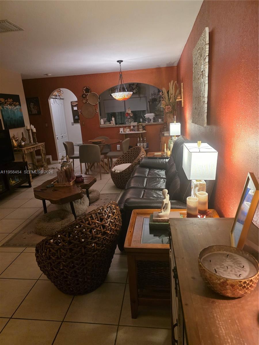 7701 West 36th Avenue, Unit 3 Hialeah, FL 33018 - Photo 2 of 28 a view of a room with gym equipment