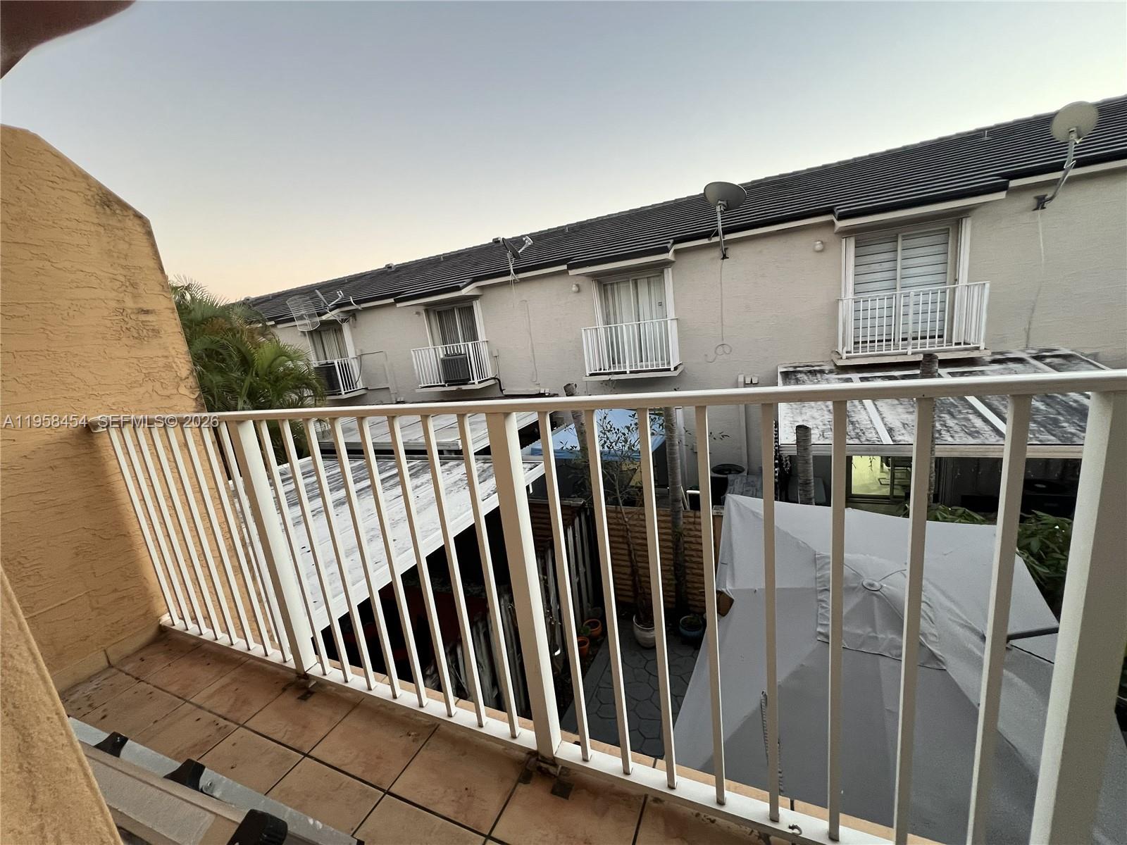 7701 West 36th Avenue, Unit 3 Hialeah, FL 33018 - Photo 23 of 28 a view of a house with a street view