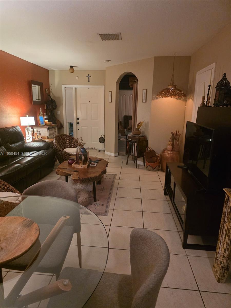 7701 West 36th Avenue, Unit 3 Hialeah, FL 33018 - Photo 3 of 28 a living room with furniture