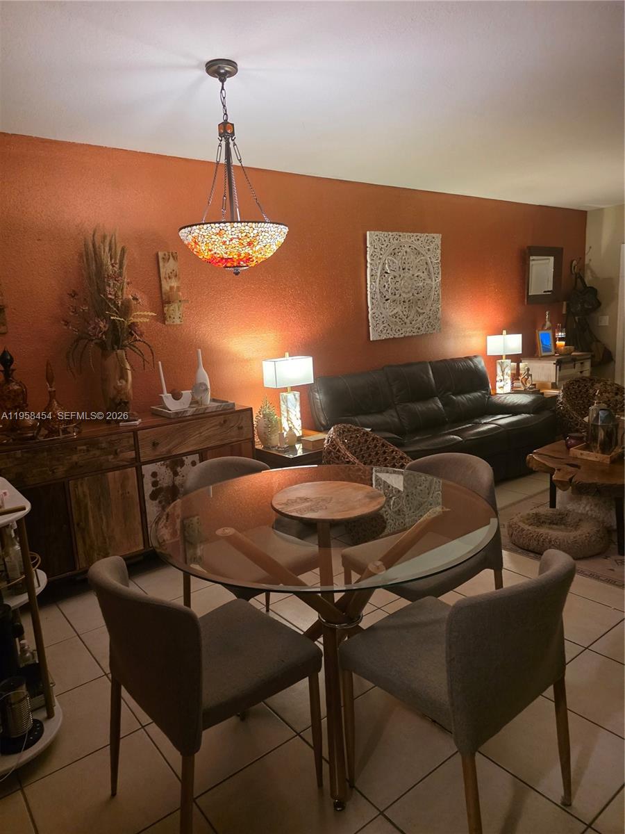 7701 West 36th Avenue, Unit 3 Hialeah, FL 33018 - Photo 4 of 28 a view of a dining room with furniture