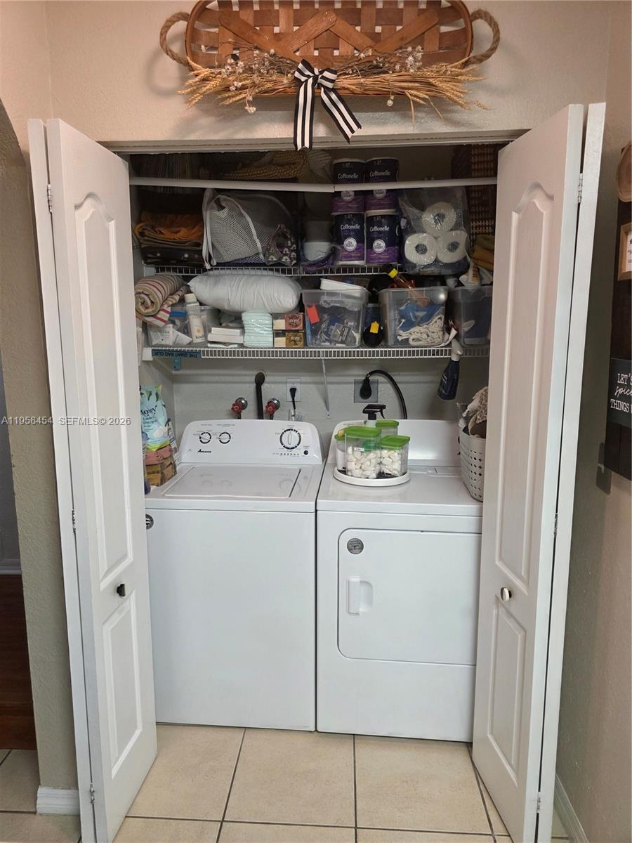 7701 West 36th Avenue, Unit 3 Hialeah, FL 33018 - Photo 5 of 28 a utility room with closet dryer and washer