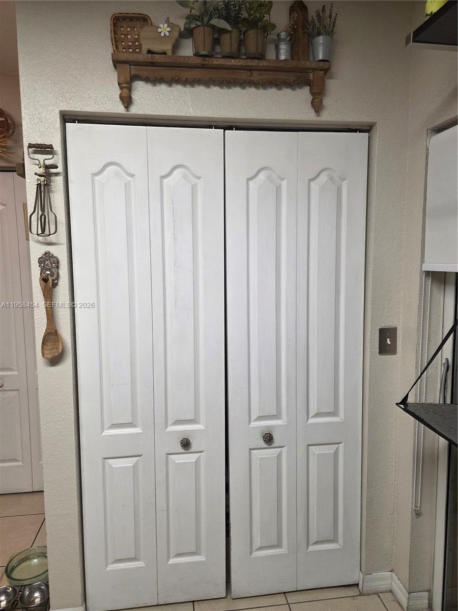 7701 West 36th Avenue, Unit 3 Hialeah, FL 33018 - Photo 6 of 28 a close view of a utility room with dryer and washer
