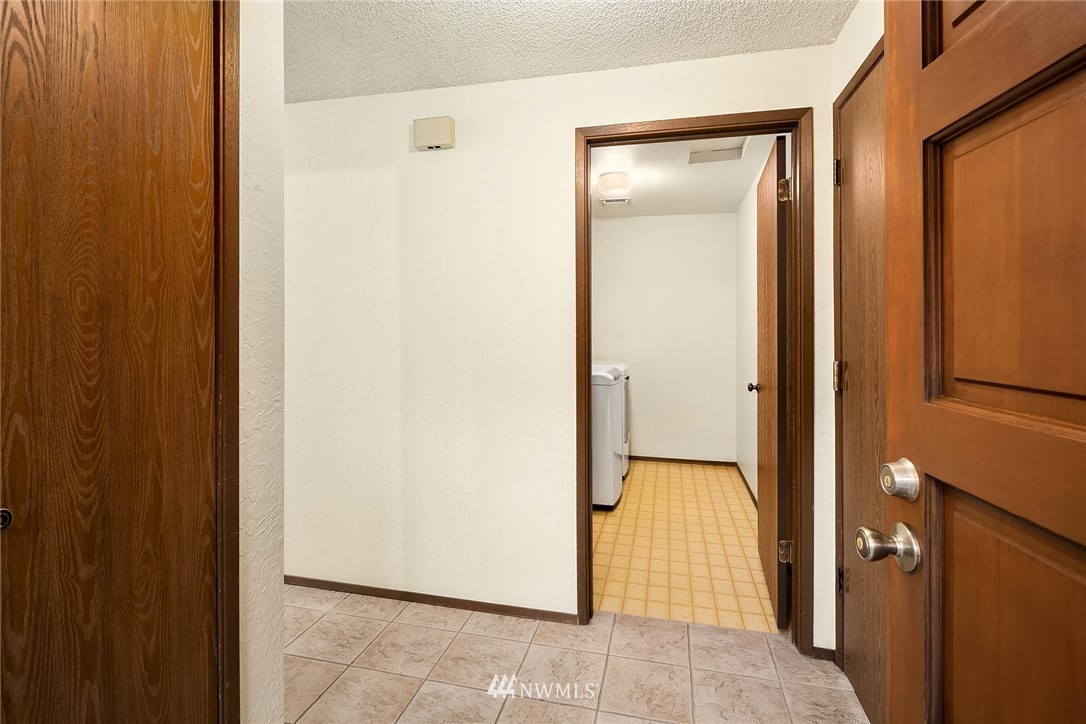 1523 Eagle Ridge Drive South, Unit 1N Renton, WA 98055 - Photo 15 of 21 a view of a room with a door