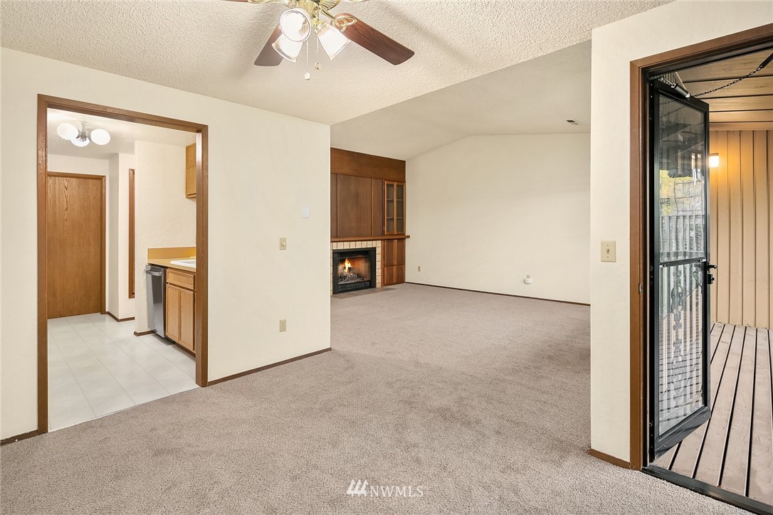 1523 Eagle Ridge Drive South, Unit 1N Renton, WA 98055 - Photo 4 of 21 an empty room with windows and closet