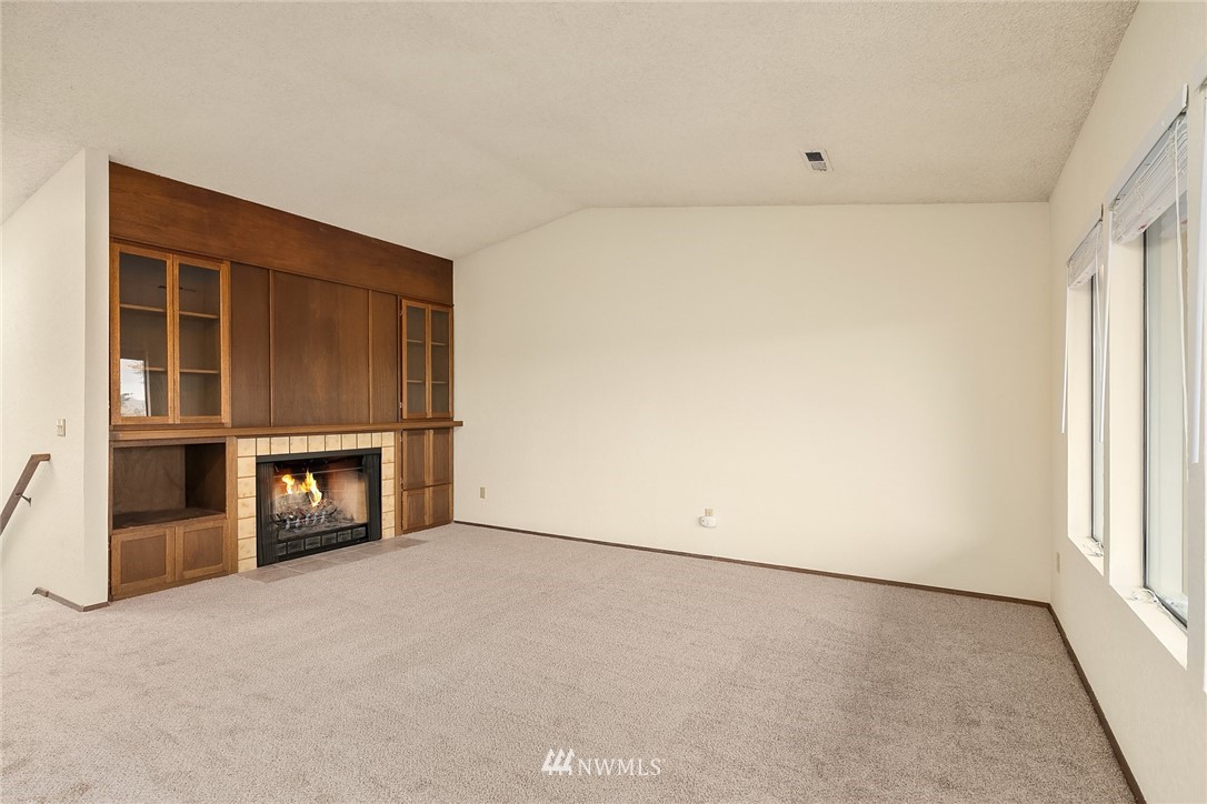 1523 Eagle Ridge Drive South, Unit 1N Renton, WA 98055 - Photo 7 of 21 an empty room with a empty space and windows