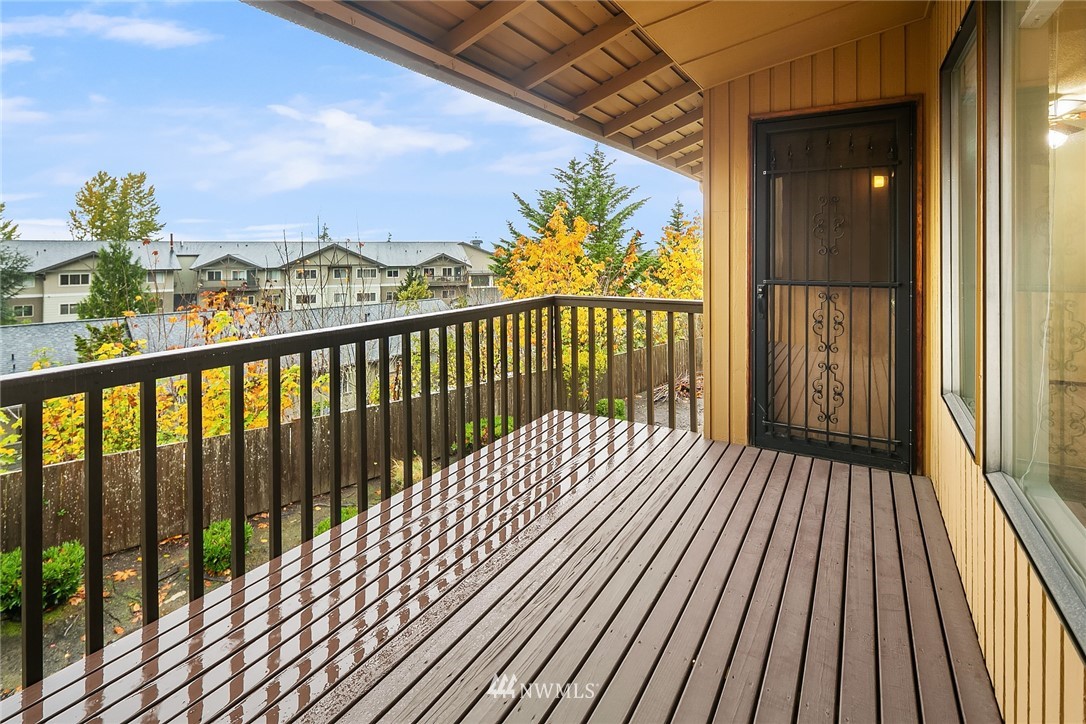 1523 Eagle Ridge Drive South, Unit 1N Renton, WA 98055 - Photo 10 of 21 a view of balcony with wooden floor