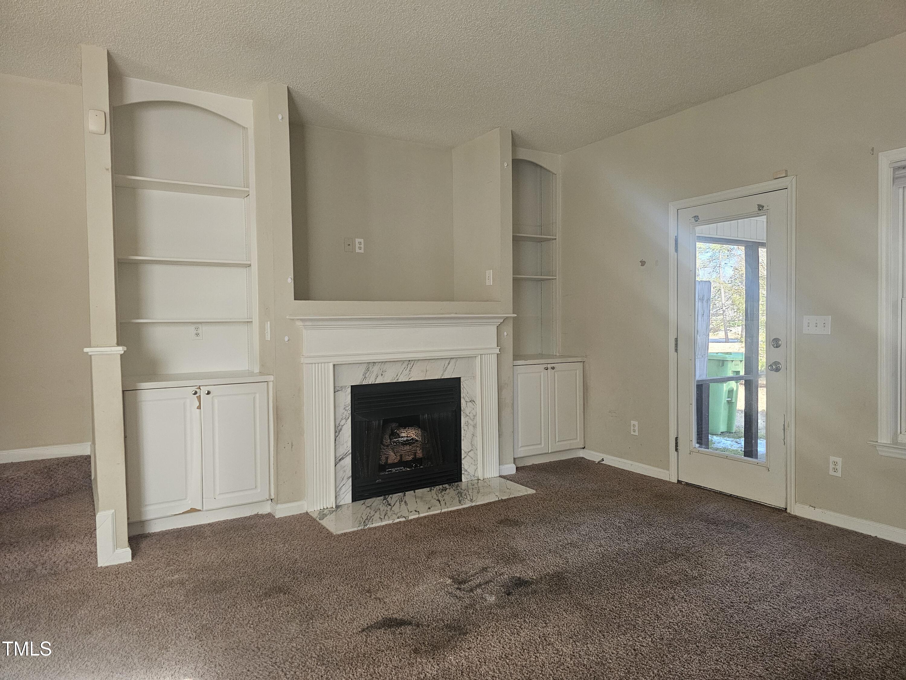 2040 Persimmon Ridge Drive Raleigh, NC 27604 - Photo 19 of 28 a view of empty room with a fireplace