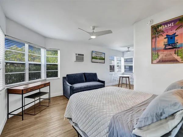a bedroom with large bed and a window