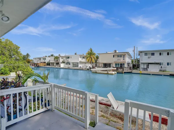 a view of a balcony with chairs