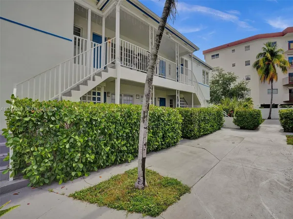 a house with trees in front of it
