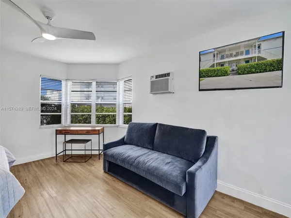a living room with furniture and a window