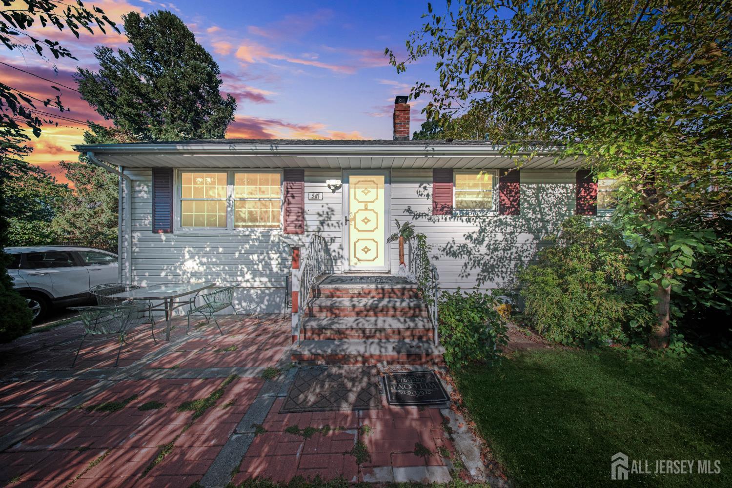 a front view of a house with garden