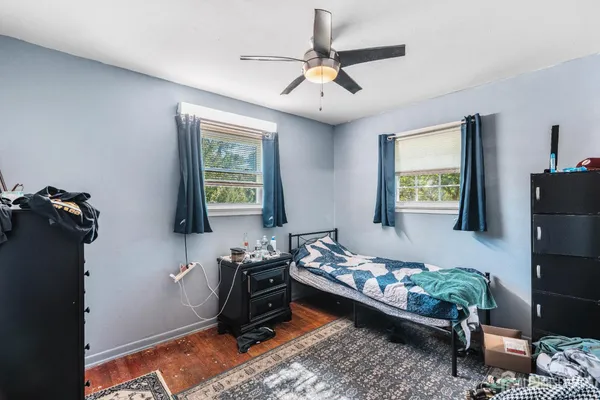 a bedroom with bed and a window