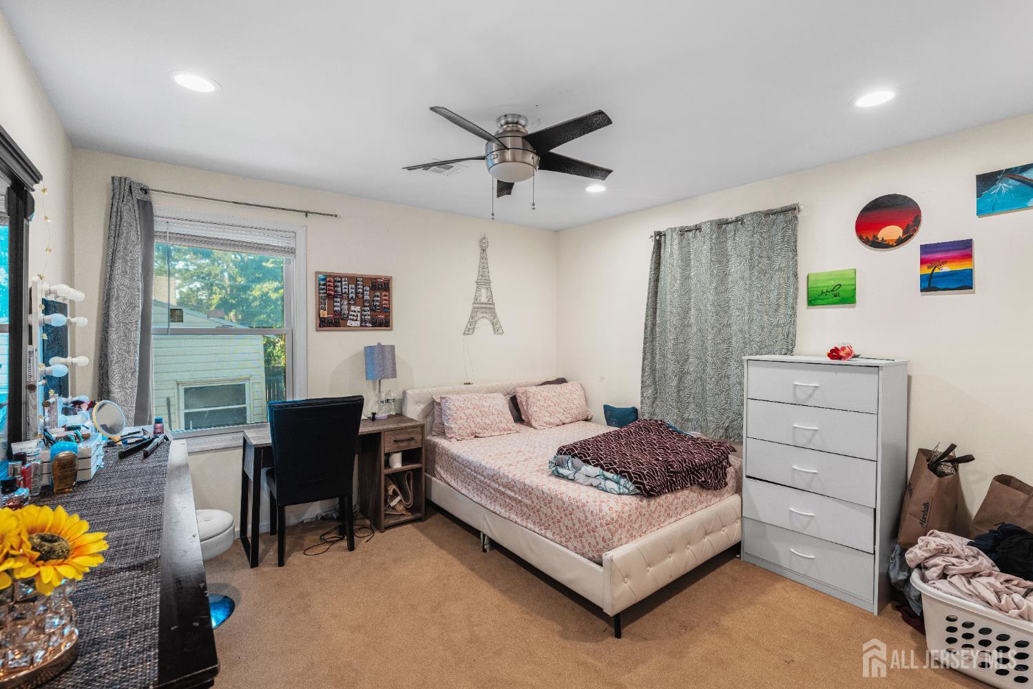 247 Adams Street Piscataway, NJ 08854 - Photo 20 of 49 a bedroom with a bed and a desk