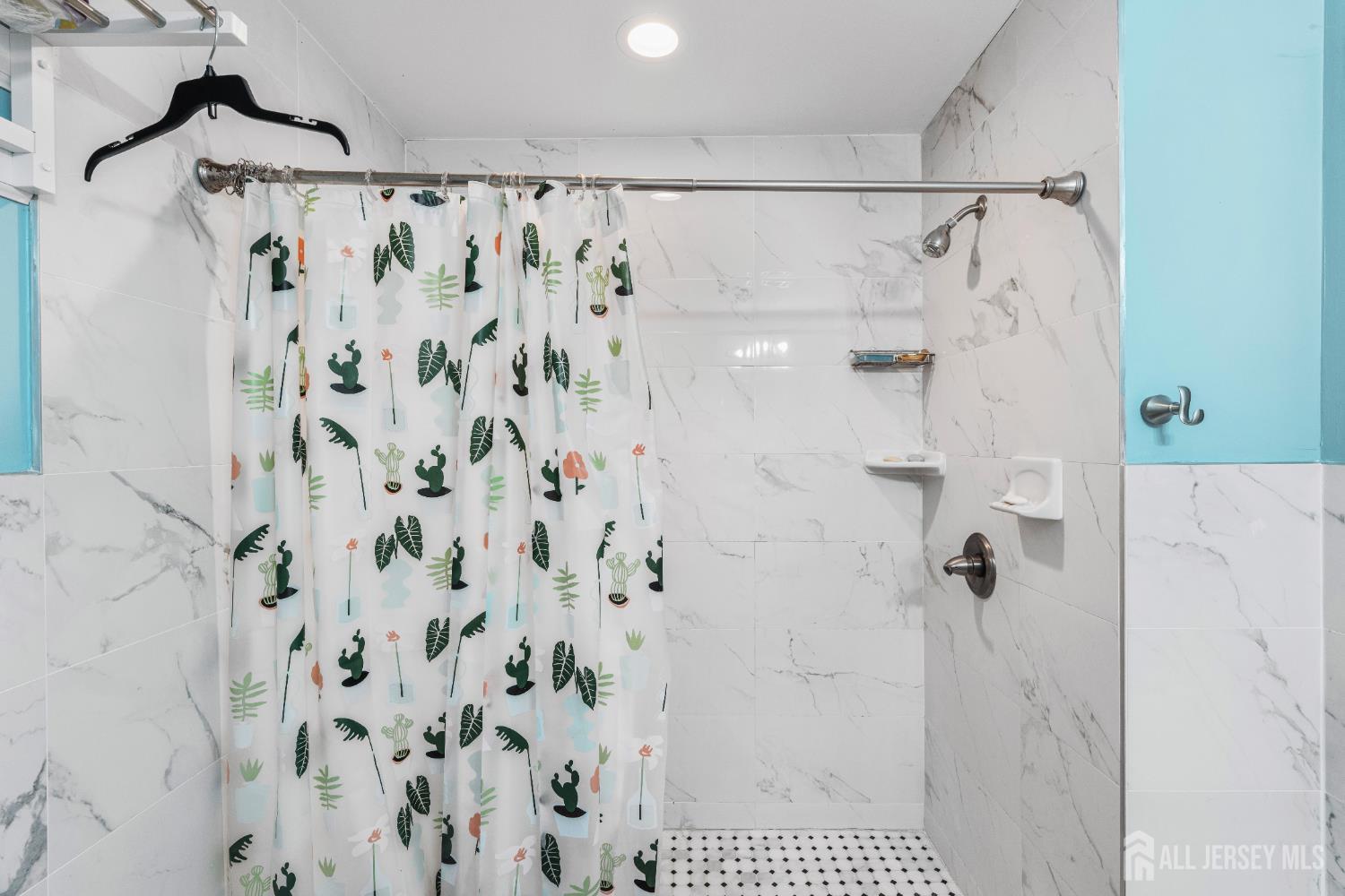 247 Adams Street Piscataway, NJ 08854 - Photo 26 of 49 a bathroom with a shower curtain