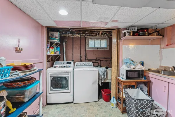 a kitchen with granite countertop a stove and wooden cabinets