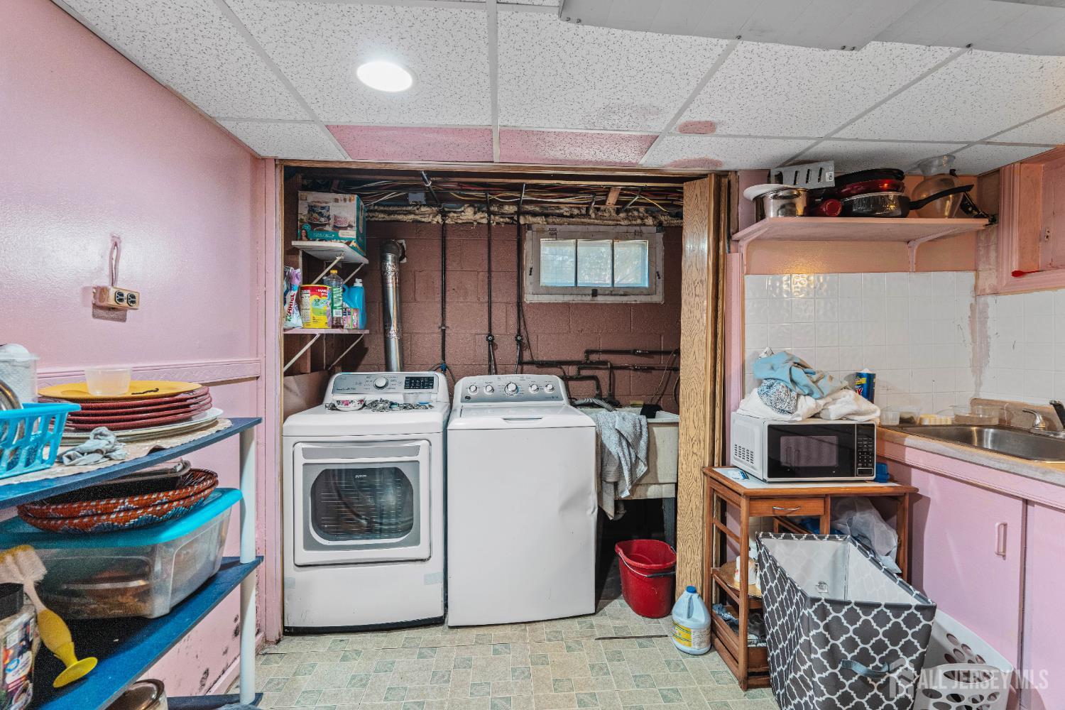 247 Adams Street Piscataway, NJ 08854 - Photo 32 of 49 a utility room with dryer and washer