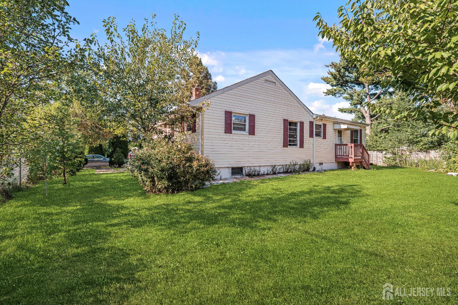 247 Adams Street Piscataway, NJ 08854 - Photo 37 of 49 a front view of house with yard and green space