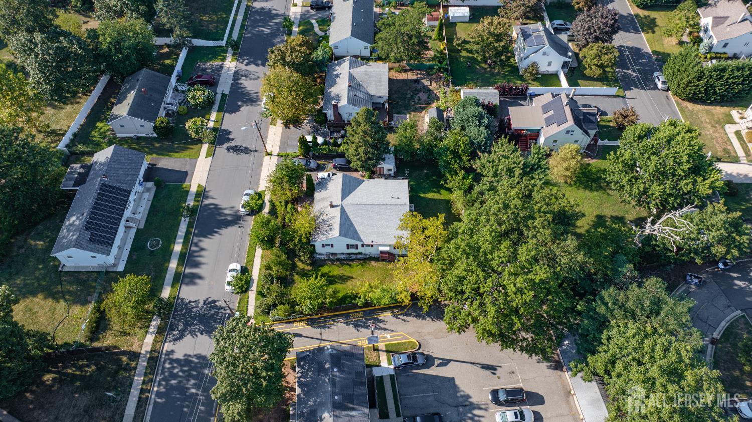 247 Adams Street Piscataway, NJ 08854 - Photo 41 of 49 an aerial view of multiple houses with yard