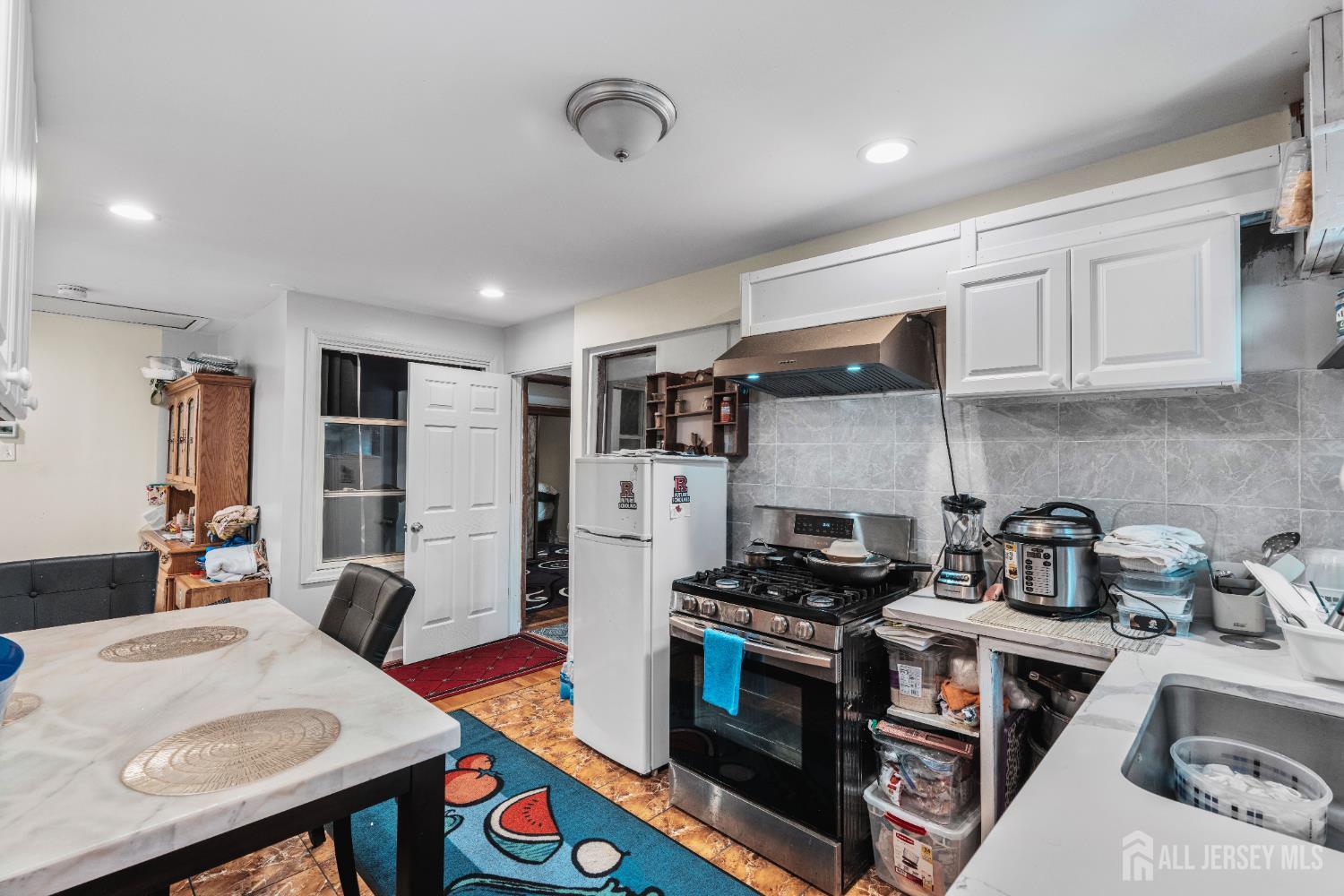 247 Adams Street Piscataway, NJ 08854 - Photo 10 of 49 a kitchen that has a stove and a refrigerator