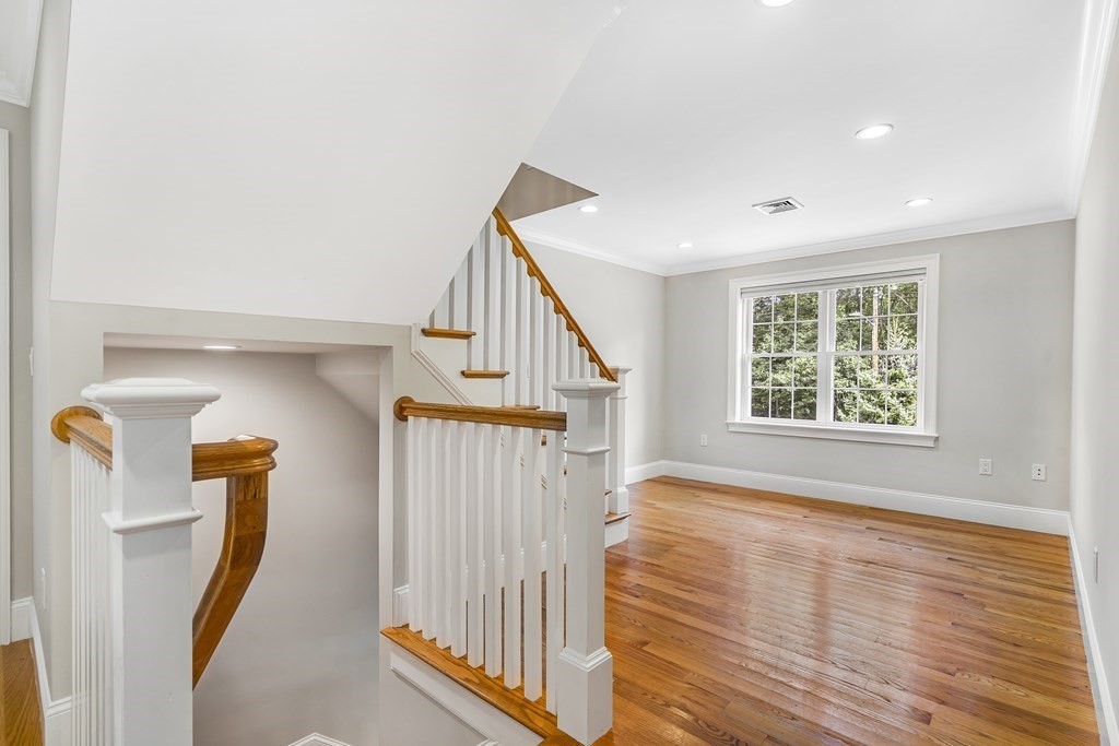 448 North Road Bedford, MA 01730 - Photo 12 of 22 a view of entryway with wooden floor and stairs