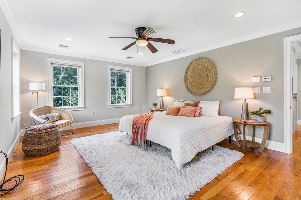 448 North Road Bedford, MA 01730 - Photo 13 of 22 a bedroom with a bed and dresser with wooden floor