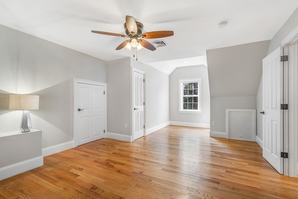 448 North Road Bedford, MA 01730 - Photo 17 of 22 a view of a livingroom with a ceiling fan and wooden floor