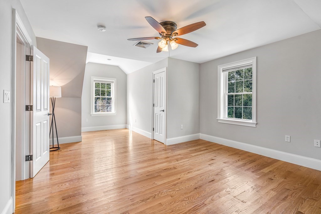 448 North Road Bedford, MA 01730 - Photo 19 of 22 a view of an empty room with wooden floor and a window