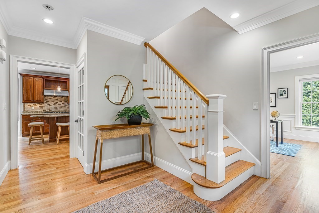 448 North Road Bedford, MA 01730 - Photo 2 of 22 a view of staircase with furniture and wooden floor